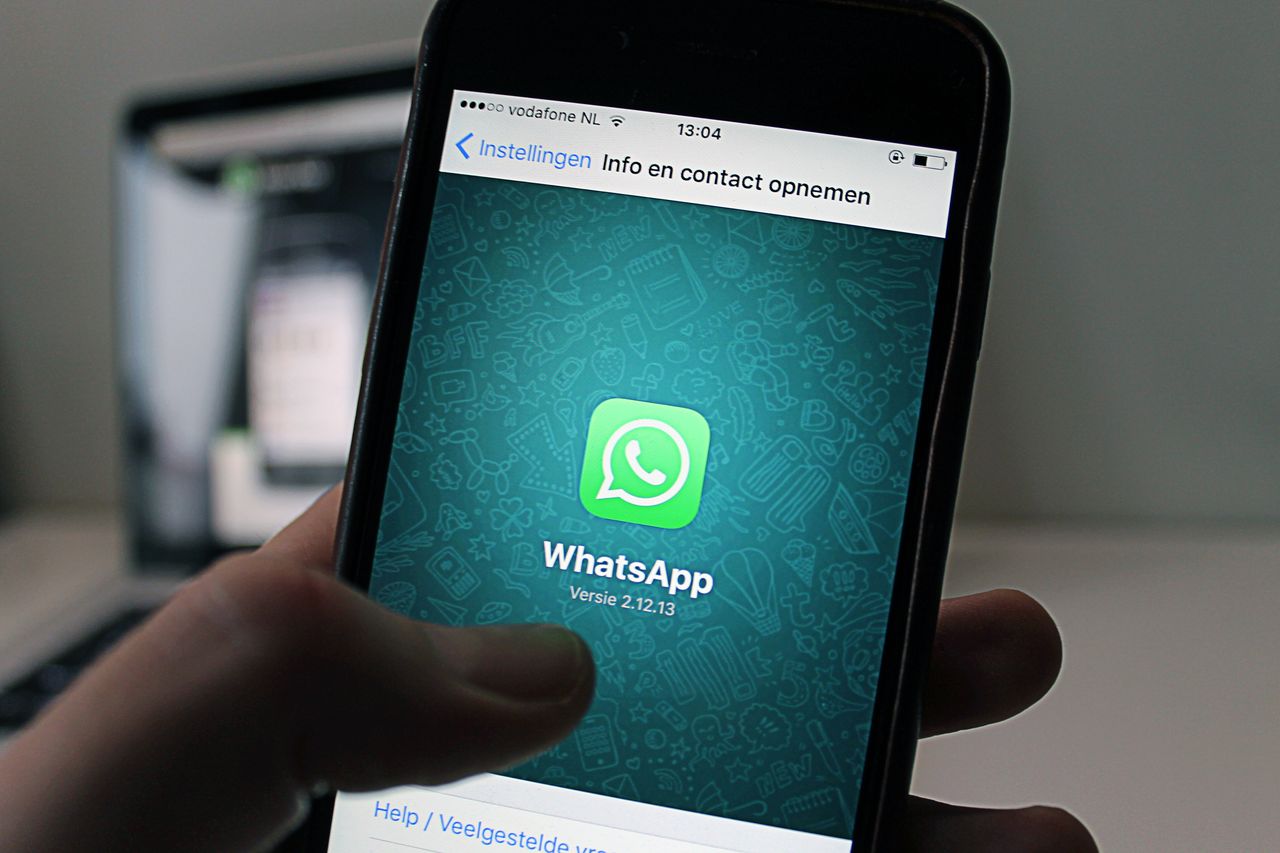 Mastering the First Impression: Your intriguing post title goes here A smartphone displaying the WhatsApp application screen held by a person.